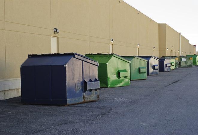 dumpsters lined up for use on busy construction site in Cloquet